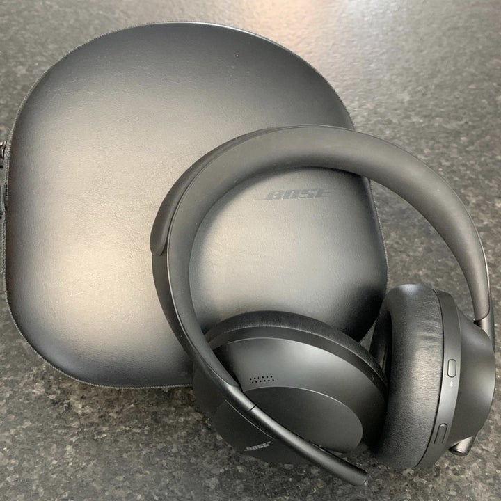 the headphones with their carrying case
