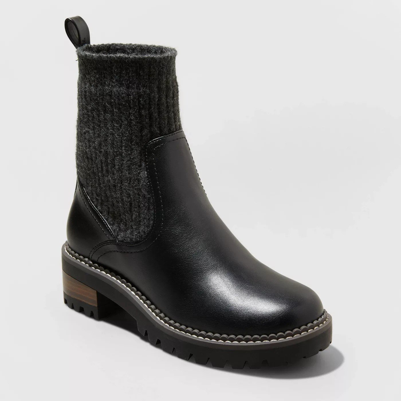 The black boot with brown heel
