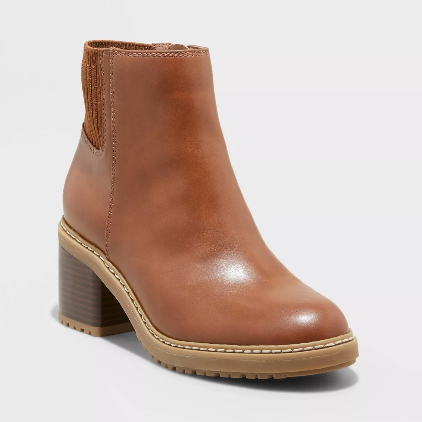 The brown boot with light brown sole and block heel