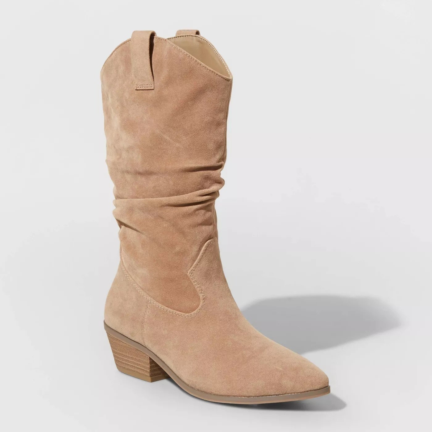 The tan boot with light brown sole