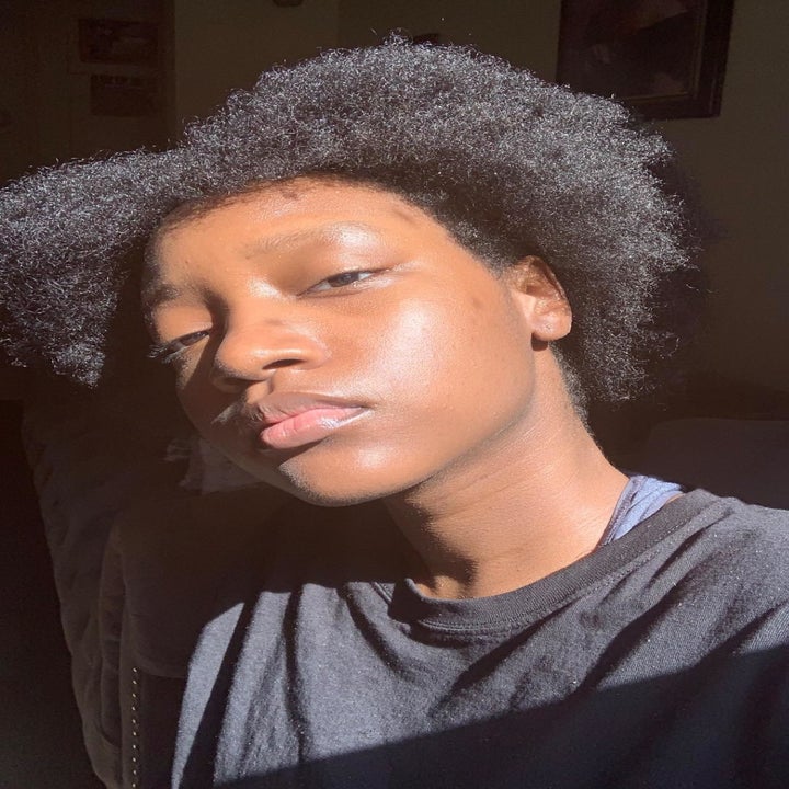 a reviewer with glowing skin after using the moisturizer