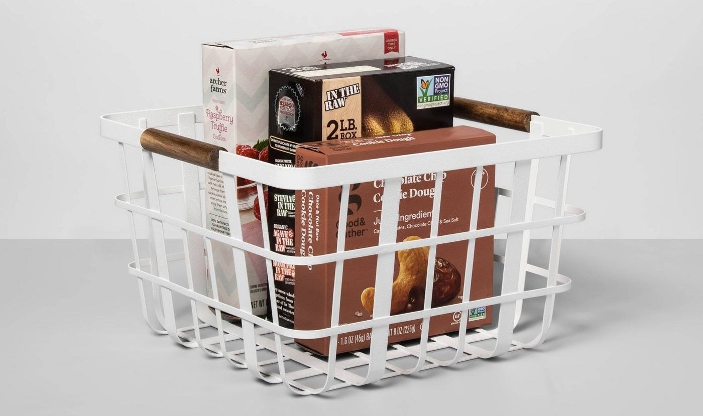 the white basket with several food boxes