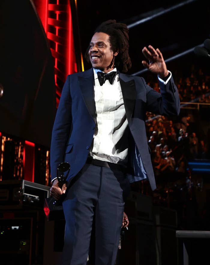 Jay-Z waving to the audience at his induction to the The Rock and Roll Hall of Fame
