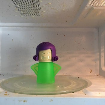 reviewer's dirty microwave with the Angry Mama inside of it