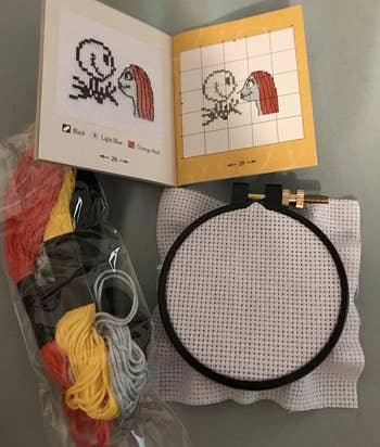 reviewer's hoop and thread with pattern beside it