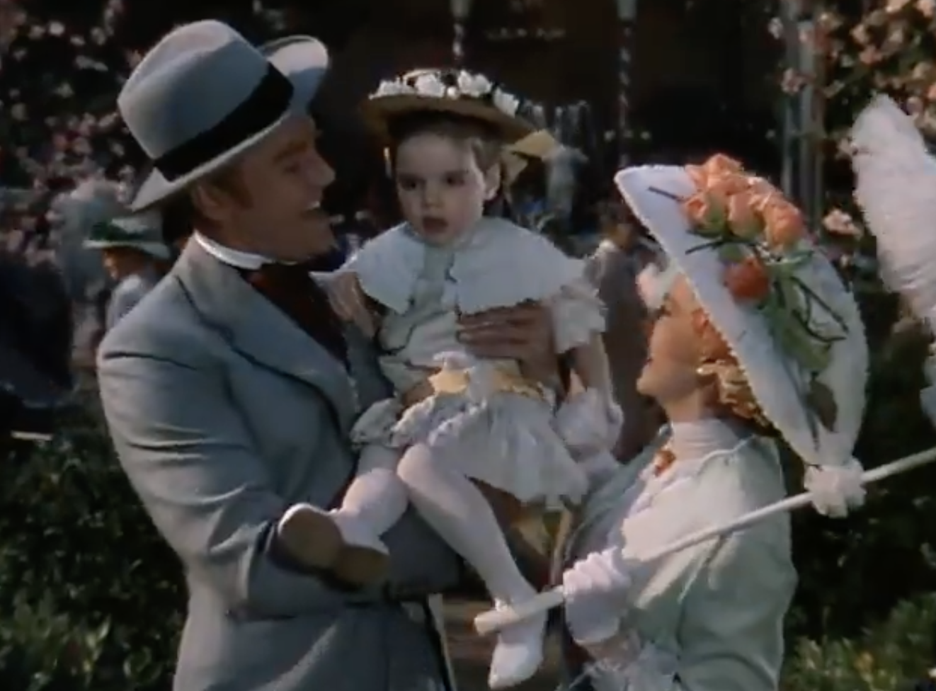 Garland holding a young Minnelli in light-colored dresses