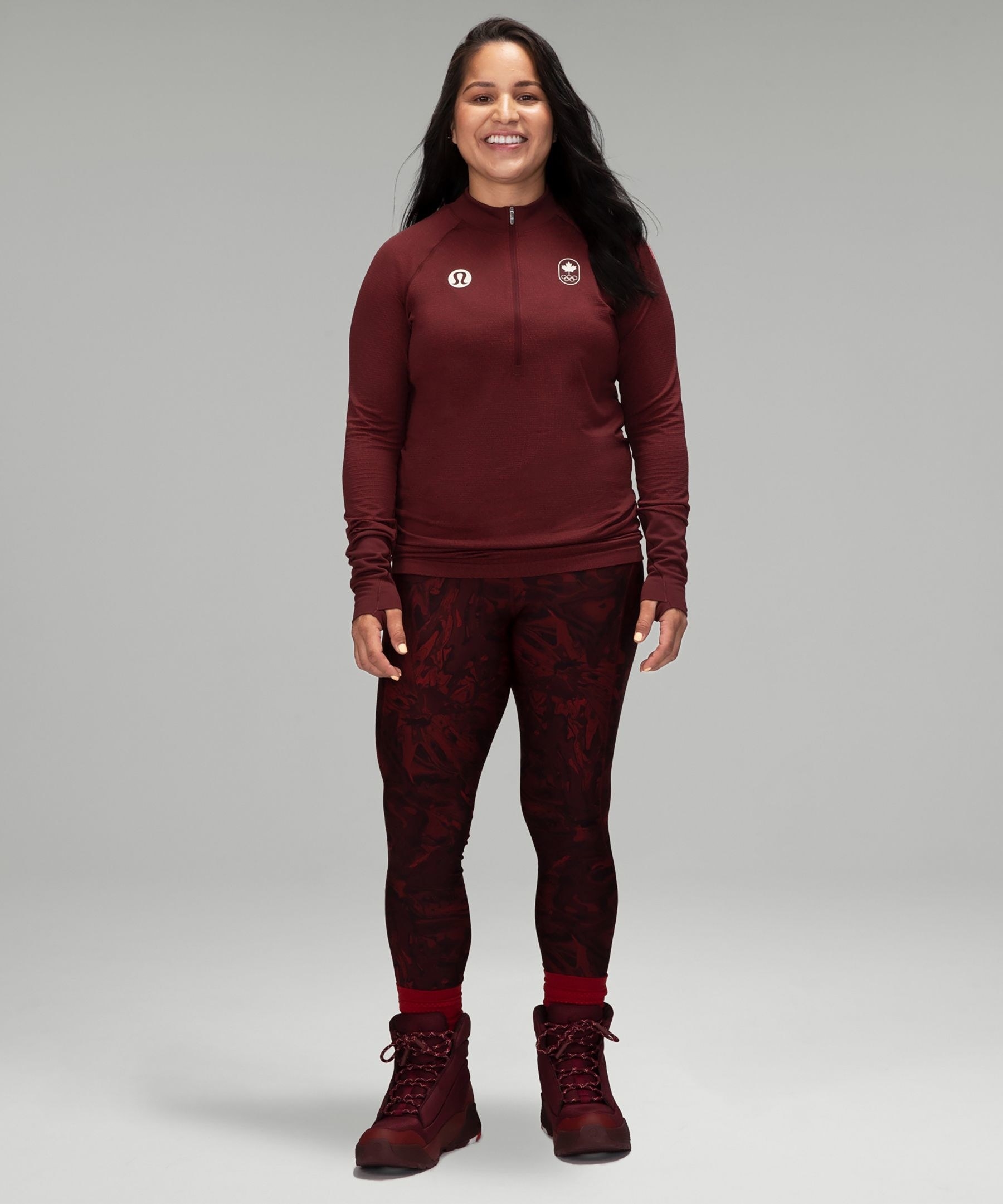 a smiling person wearing the thermal leggings