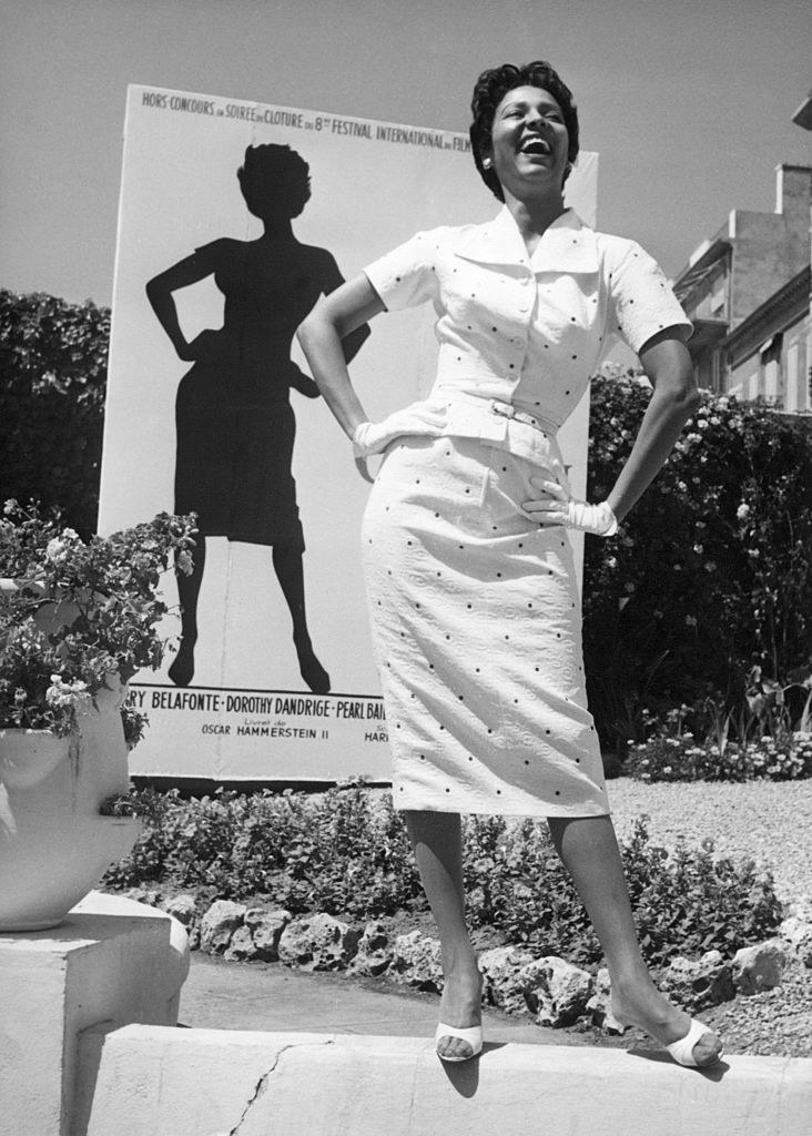 Dorothy Dandridge posing for a life size billboard near her