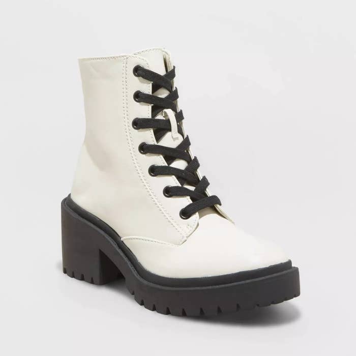 The white boot with a black sole and black laces