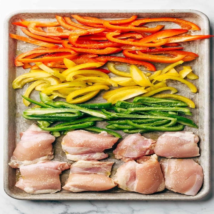 Chicken and peppers on a sheet pan.