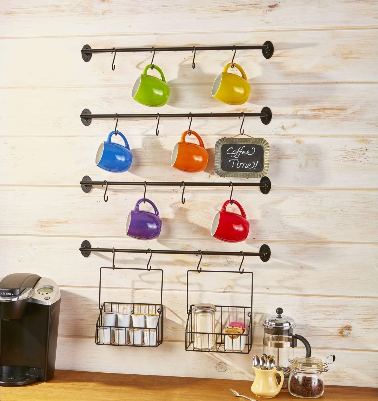 the hooks on a wall with mugs
