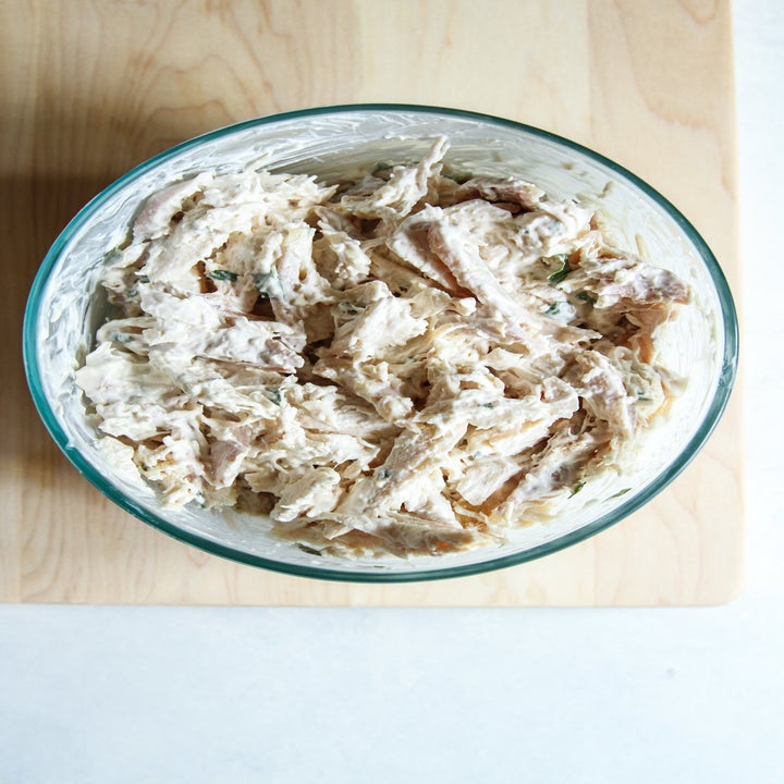 Chicken salad in a mixing bowl.