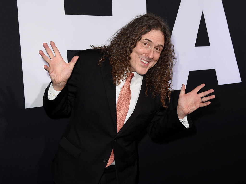 Weird Al with hands held up and to the sides