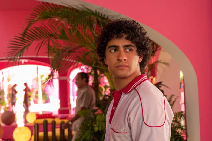 Enrique Arrizon standing in a pink hotel
