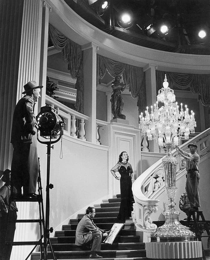 Hedy Lamarr walking down the stairs during a movie production