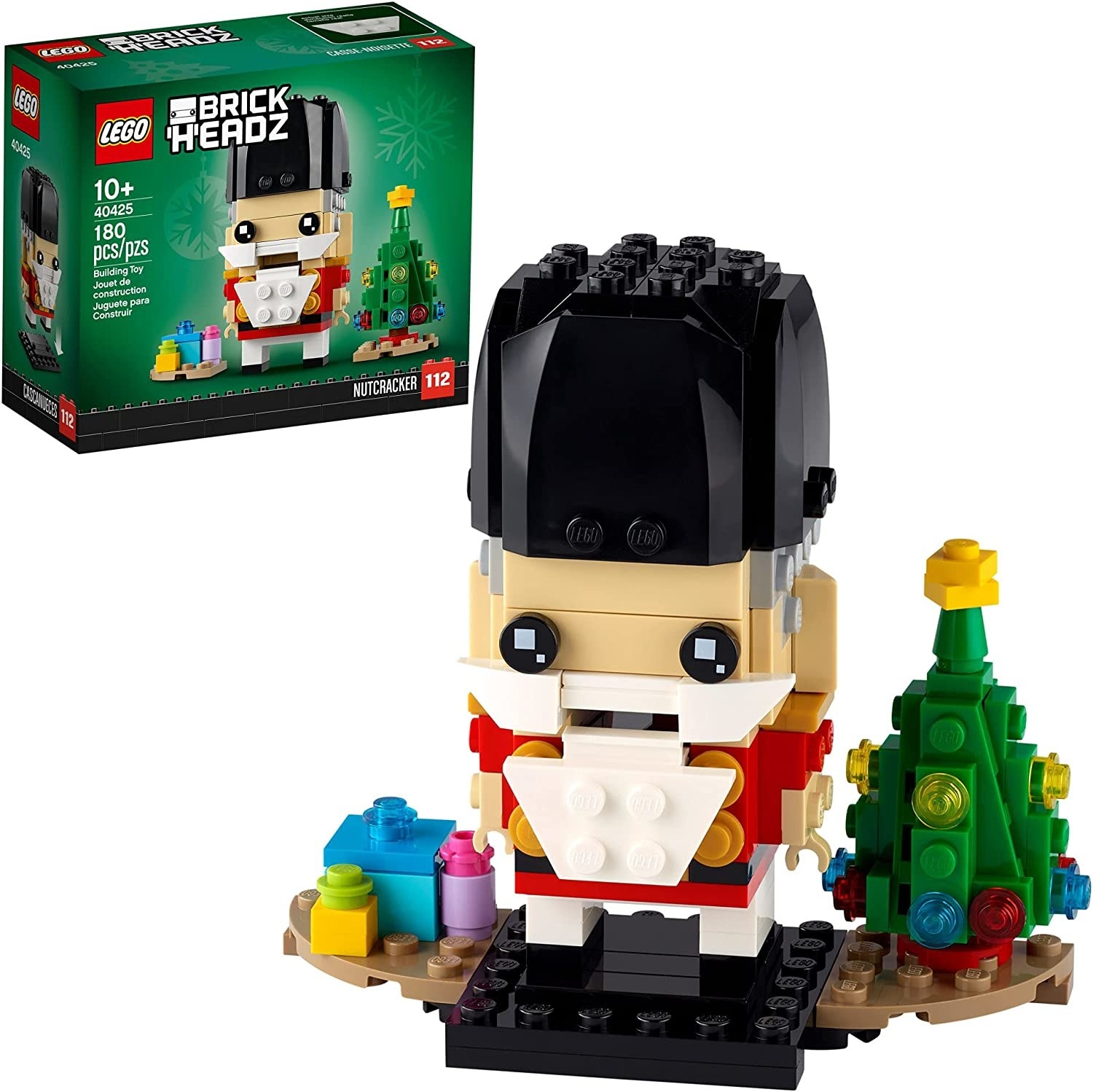 The Lego nutcracker figure next to a christmas tree
