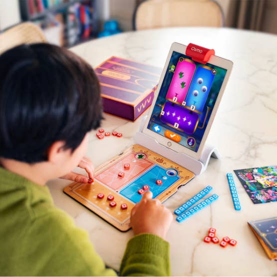 Child playing with Osmo's Math Wizard game