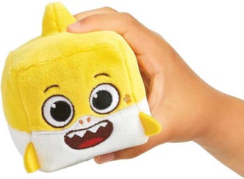 yellow cube shaped shark plush toy