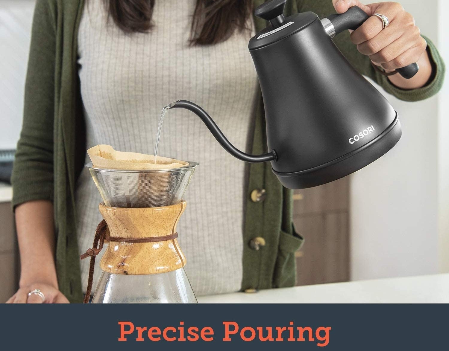 someone using the gooseneck kettle to make pourover coffee