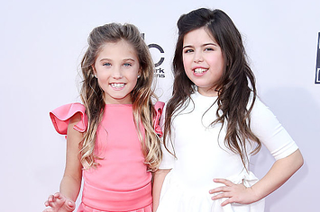 sophia grace and rosie on a pink carpet