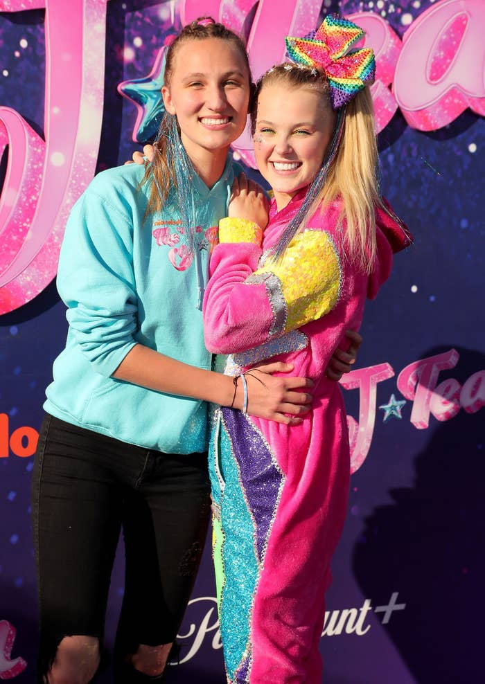 Kylie Prew poses for a picture with JoJo Siwa with her arms around her waist