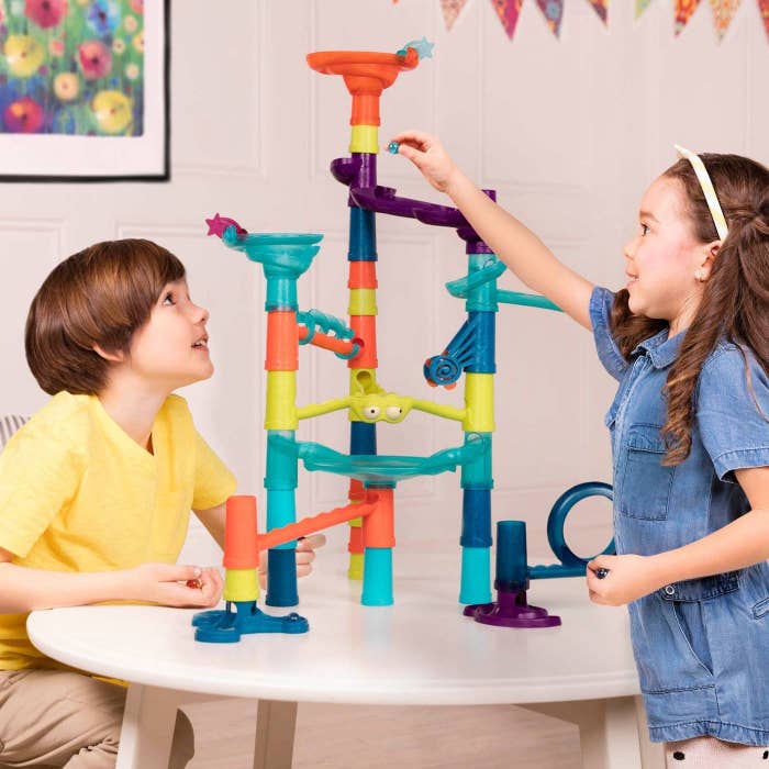Kids playing with marble run
