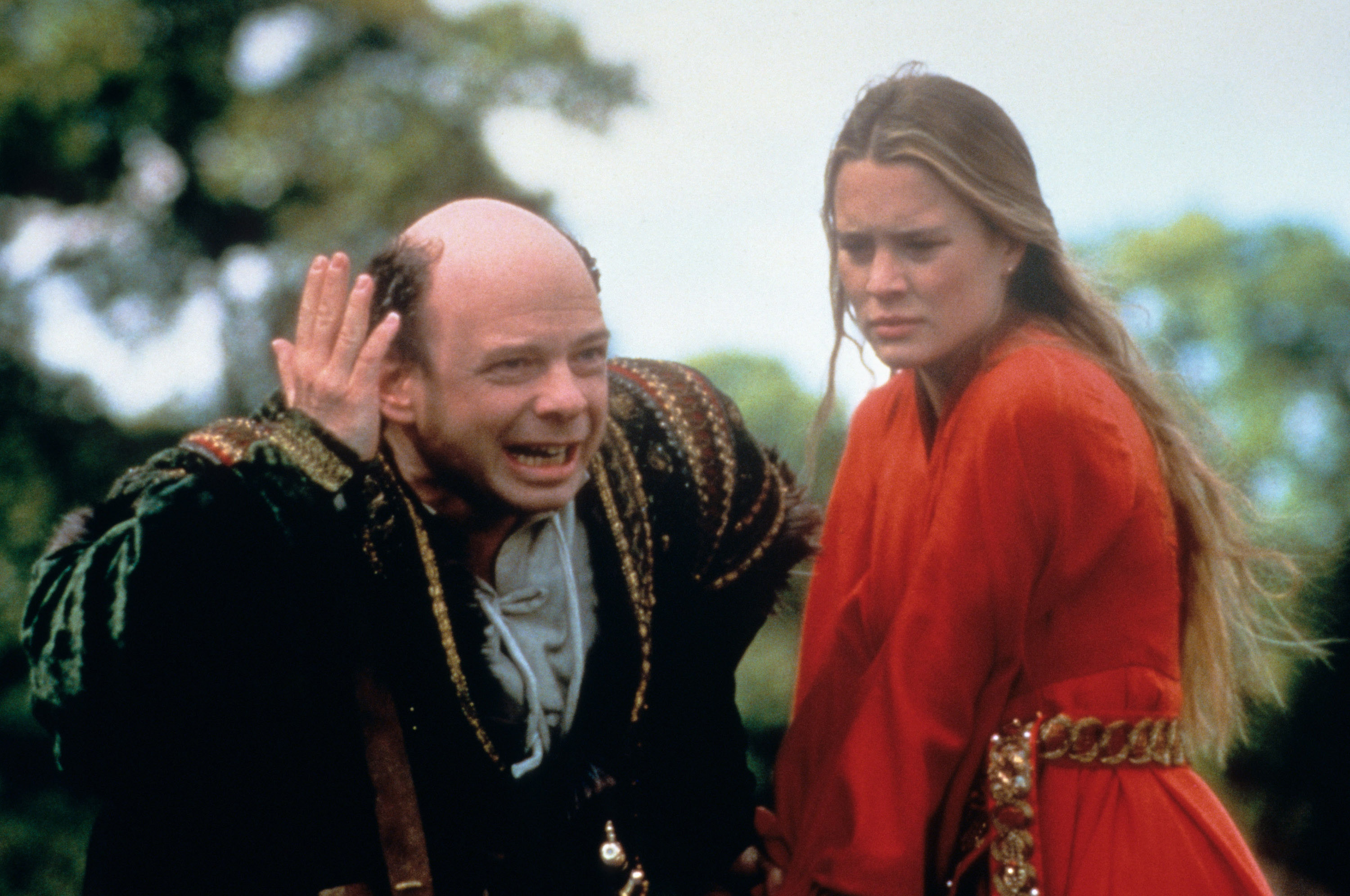 Wallace Shawn and Robin Wright stand together in the woods