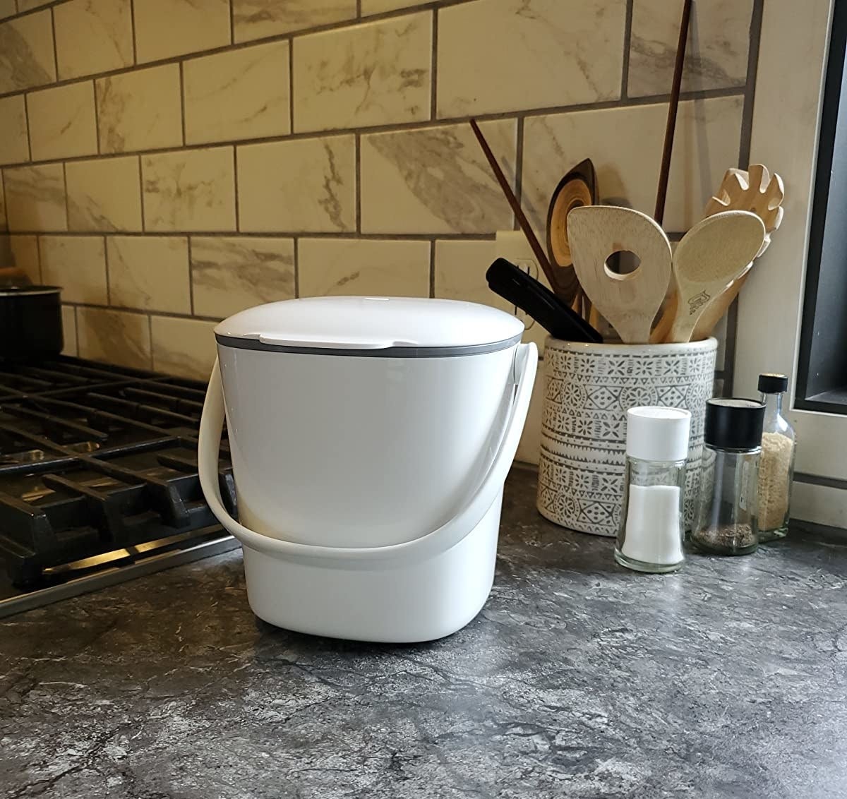 Reviewer photo of the white composting bin on a counter
