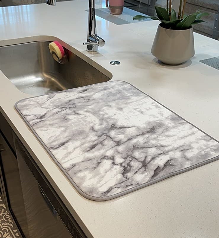 Reviewer photo of the marble mat on a counter