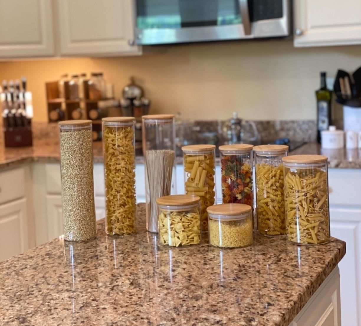 Reviewer photo of the containers on a counter with dried pasta and grains inside each one