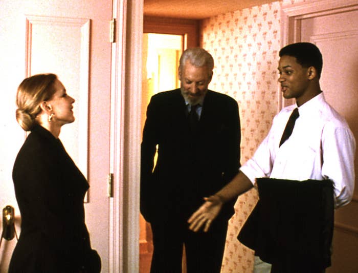 Paul reaching out to shake the hand of Stockard Channing's character