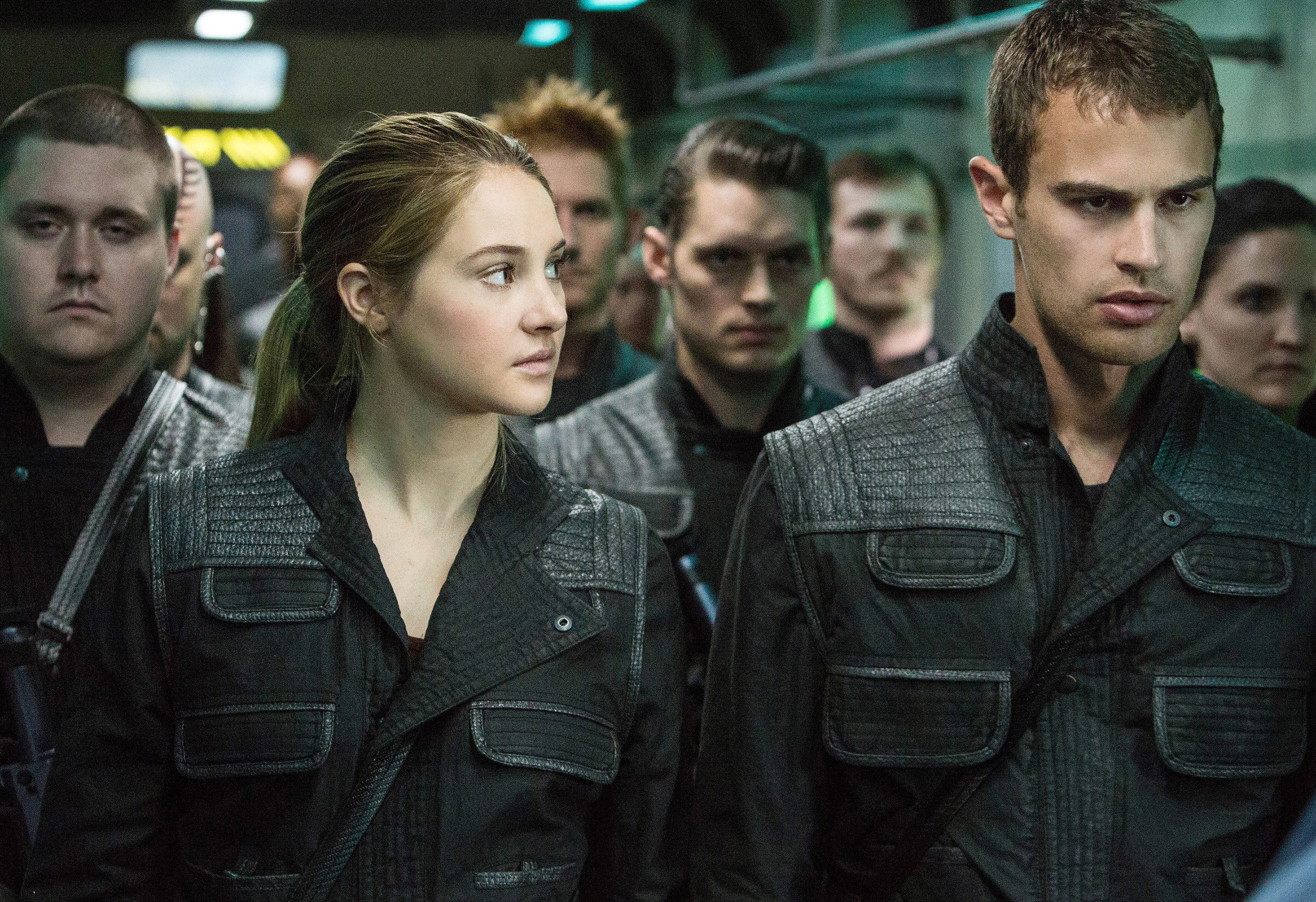 Shailene Woodley looks at Theo James as they wear matching black outfits