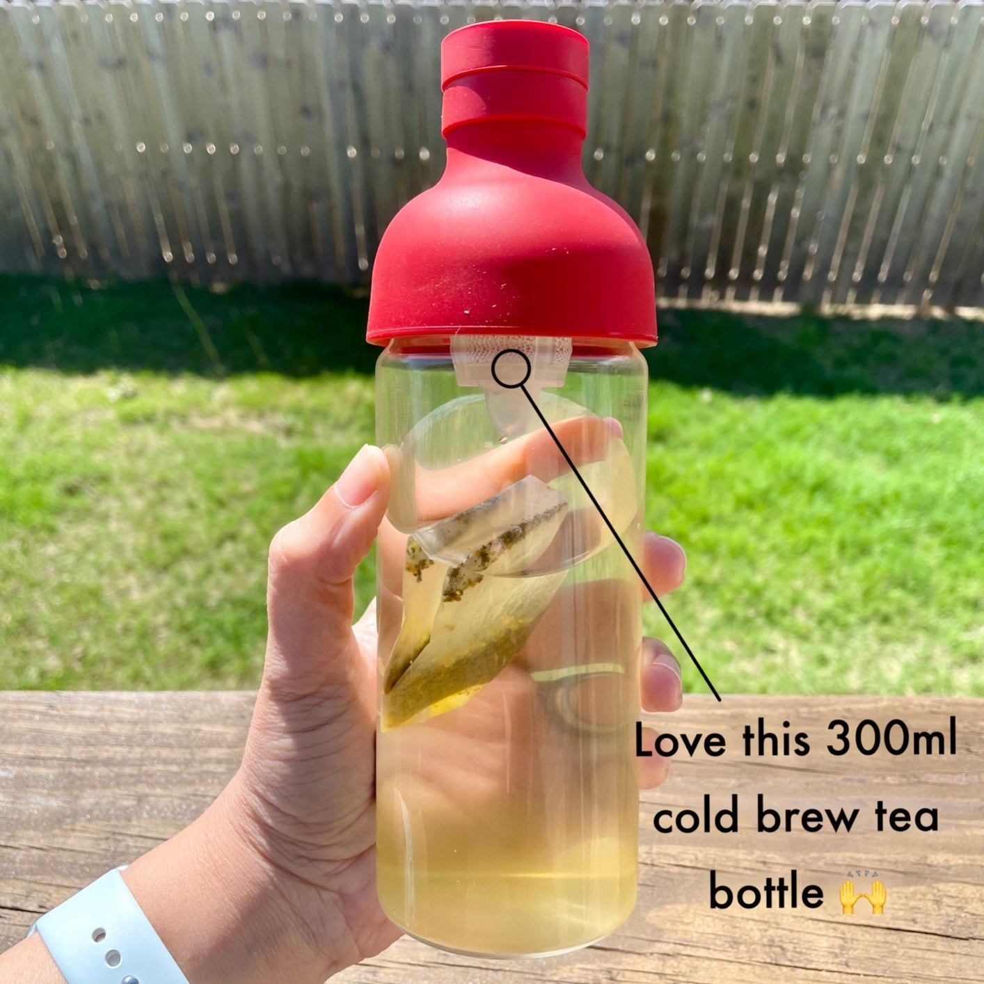 Reviewer is holding the bottle with overlay text that says &quot;love this 300ml cold brew tea bottle&quot;