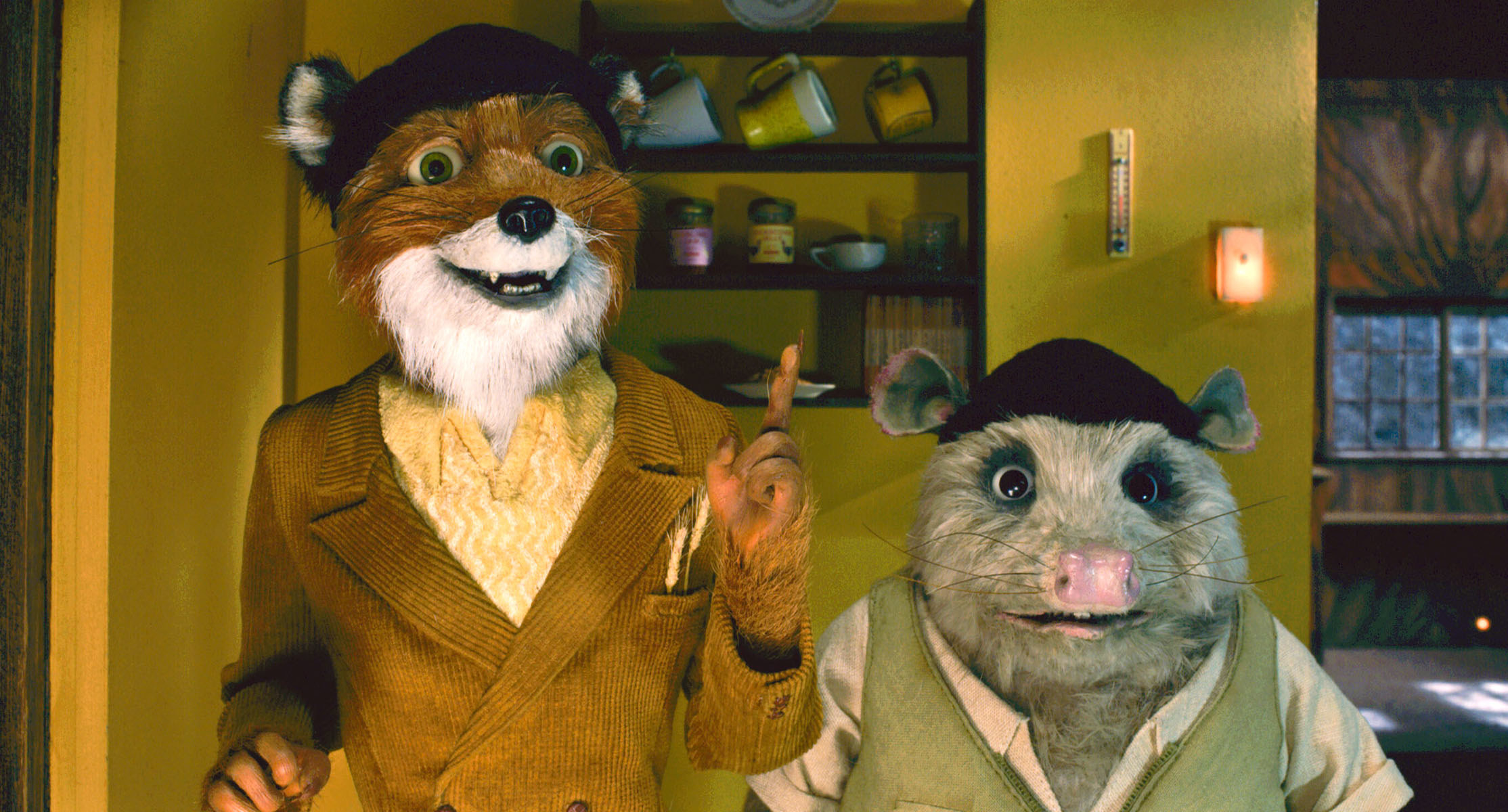 Mr. Fox and Kylie stand next to each other with hats on