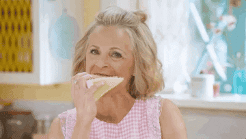 woman with chin-length hair eats cake