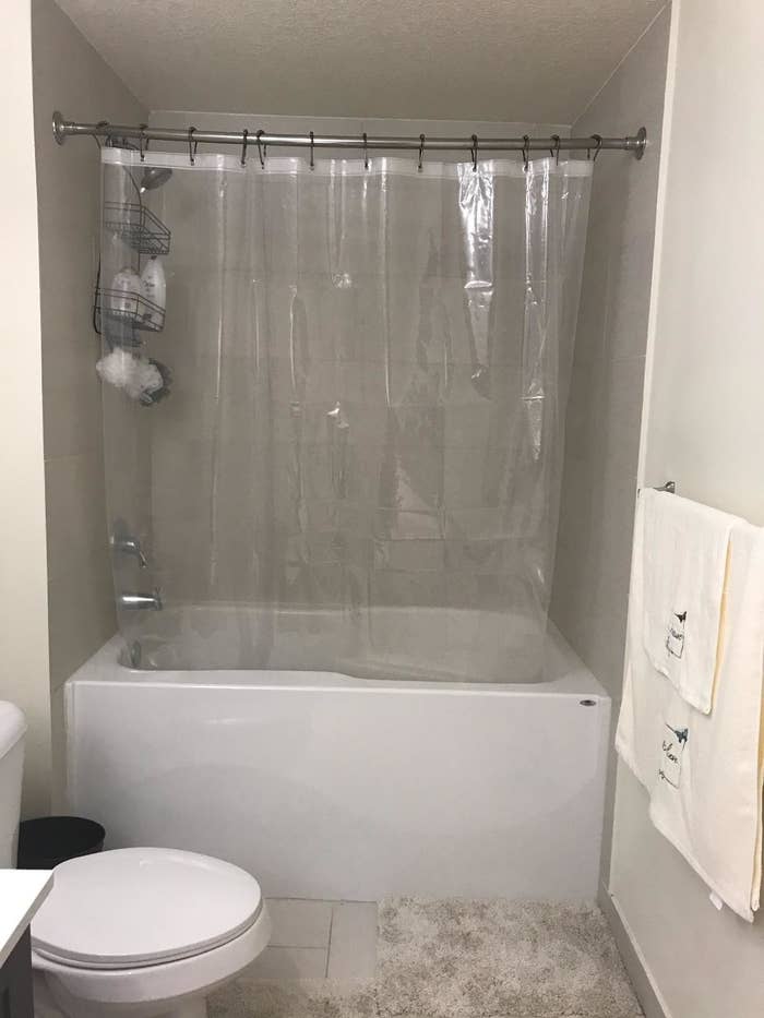 Reviewer&#x27;s bathroom with anti-mildew shower curtain hanging