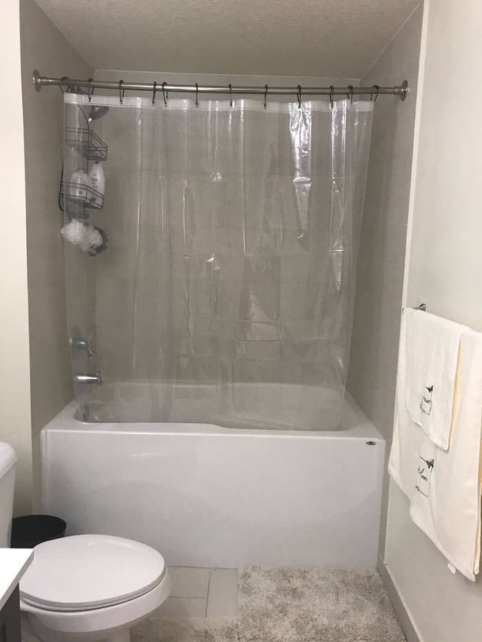 Reviewer's bathroom with anti-mildew shower curtain hanging