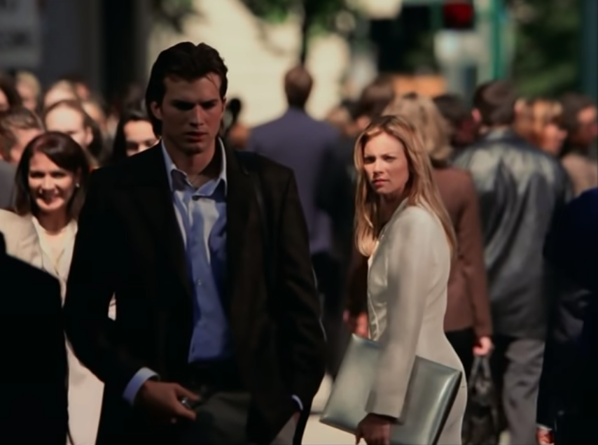 Evan and Kayleigh walking through a crowded street in New York City