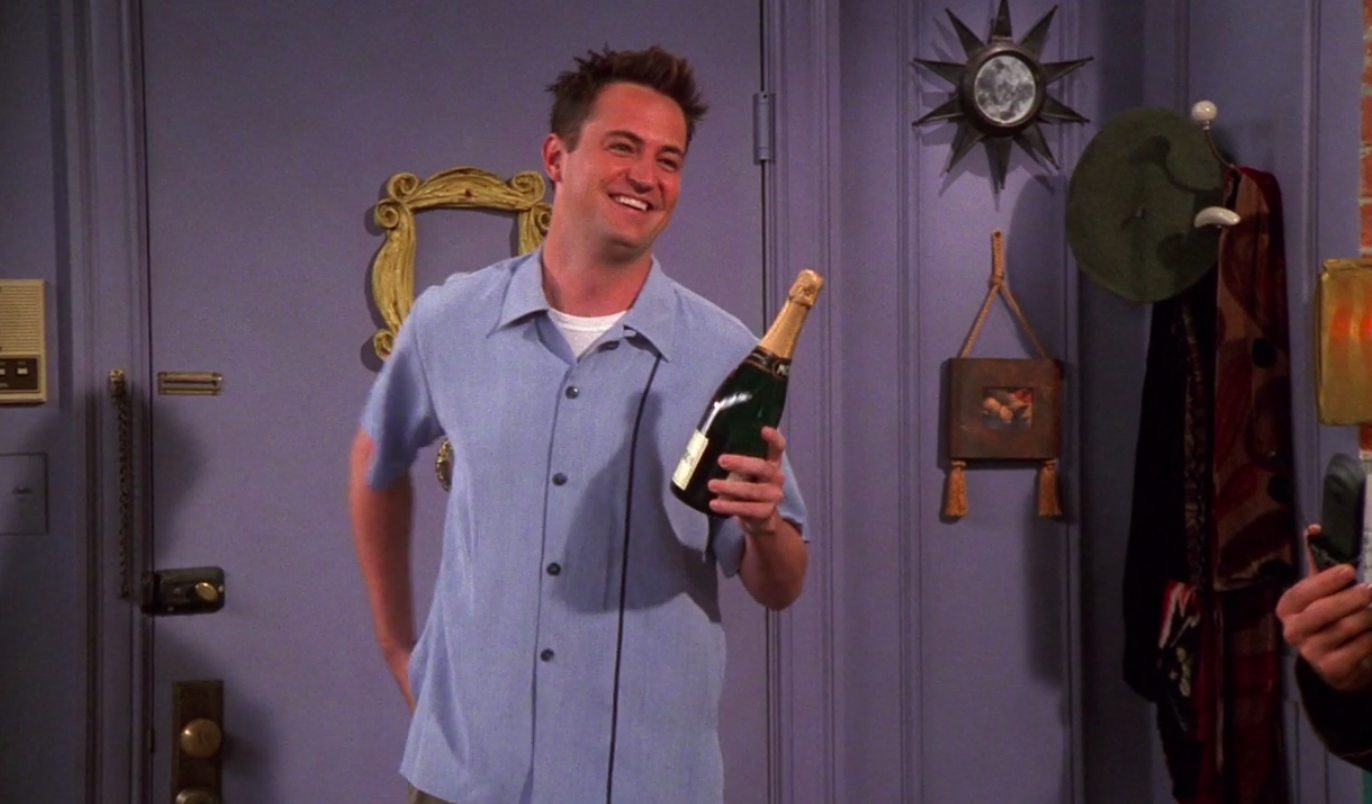 Chandler wearing pants and a bowling shirt