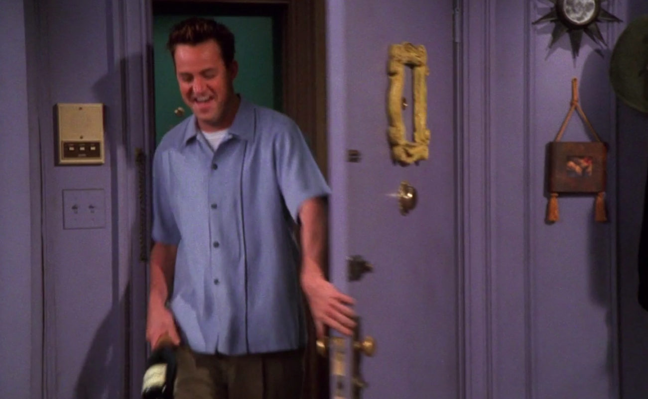 Chandler wearing pants and a bowling shirt