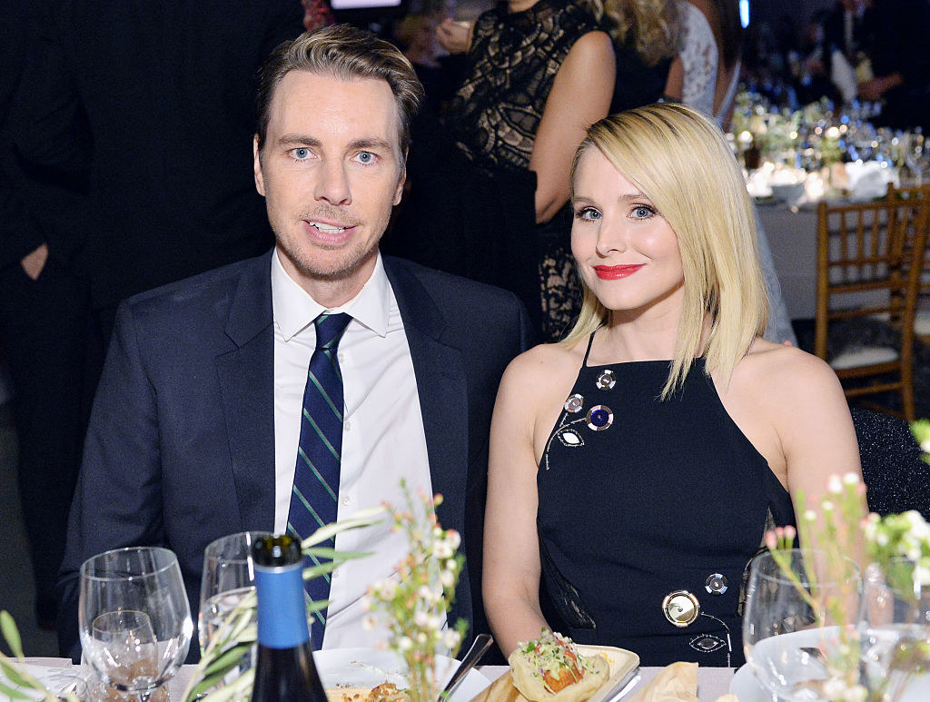 Dax Shepard (L) and Kristen Bell sit at a dinner table at the the Fifth Annual Baby2Baby Gala