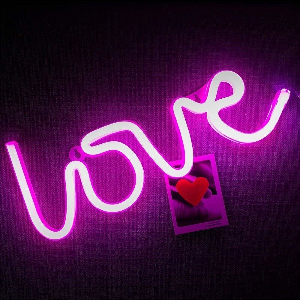 A neon sign that says &quot;Love&quot;