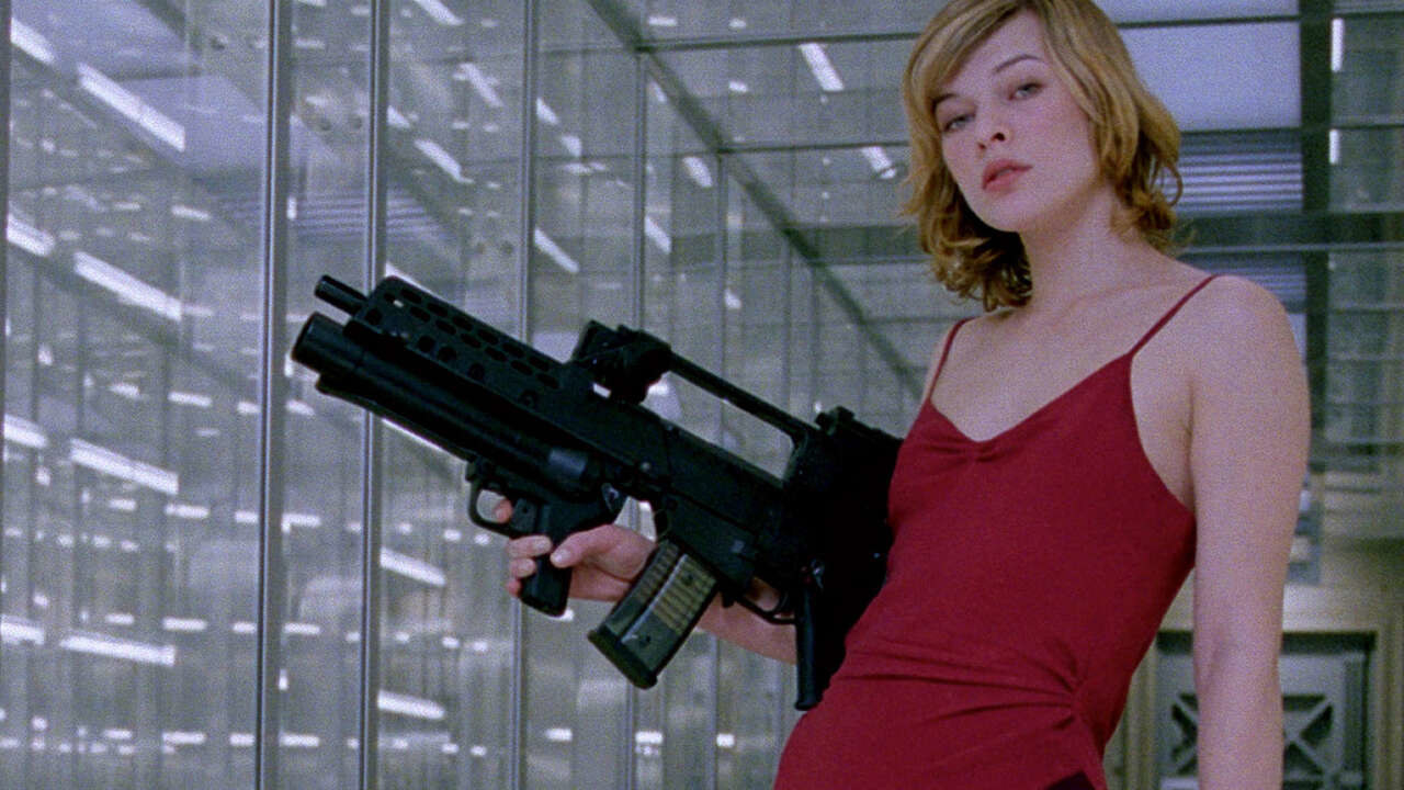 milla jovovich as alice holding a gun