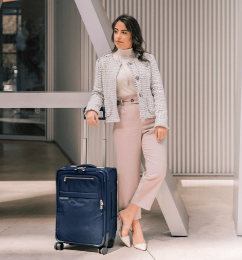 model with navy suitcase