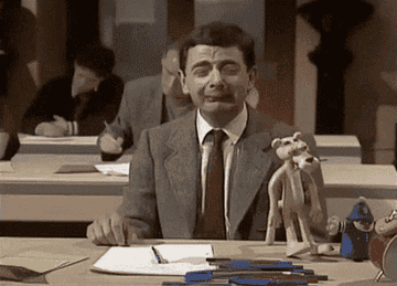 Mr. Bean is crying during an exam.