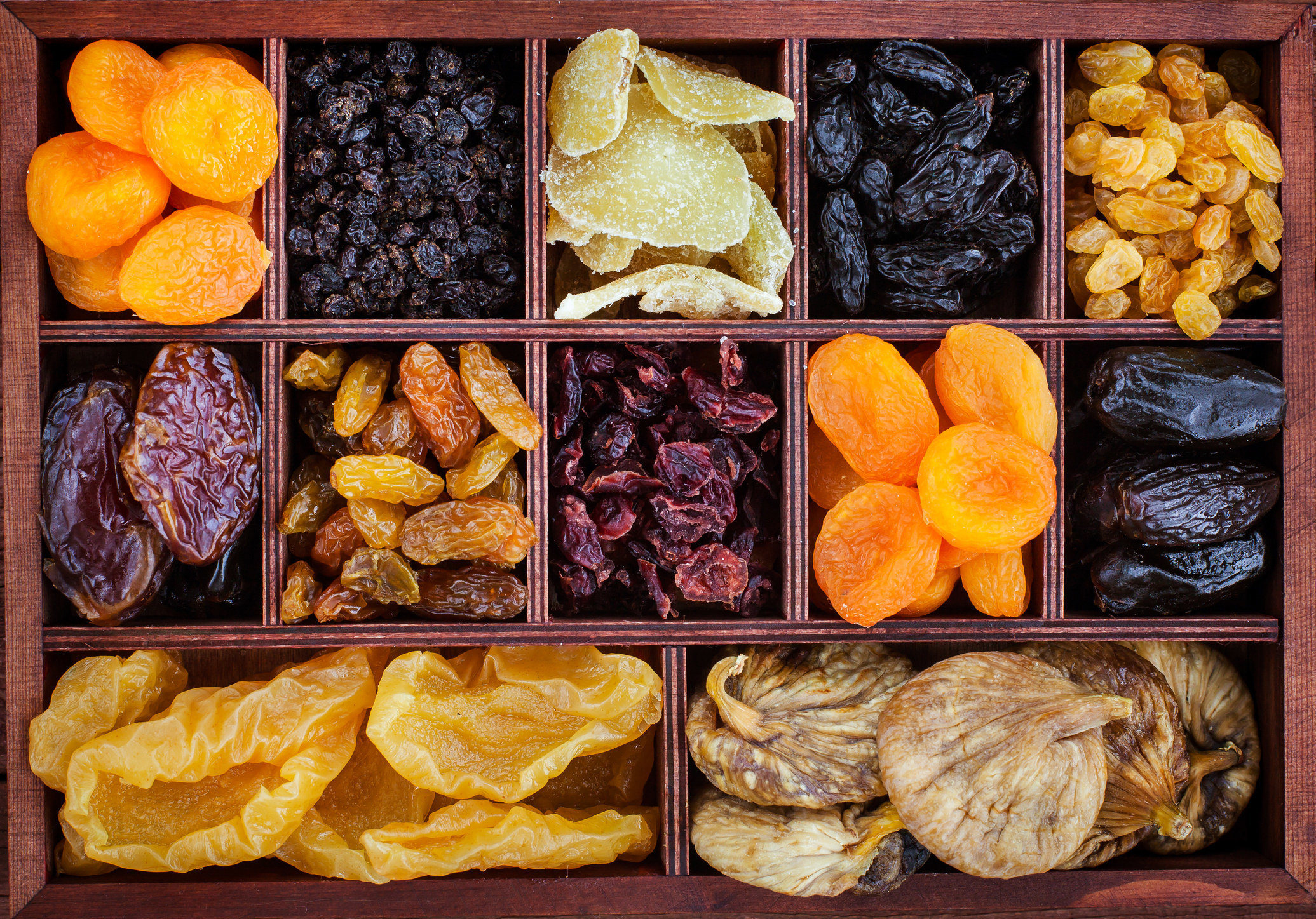 A box with dried fruit in different compartments.