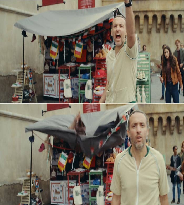 A man falls on a roadside stall.