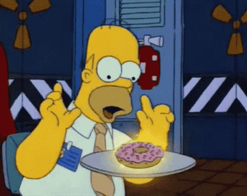 Homer Simpson waggling his fingers over a glowing donut