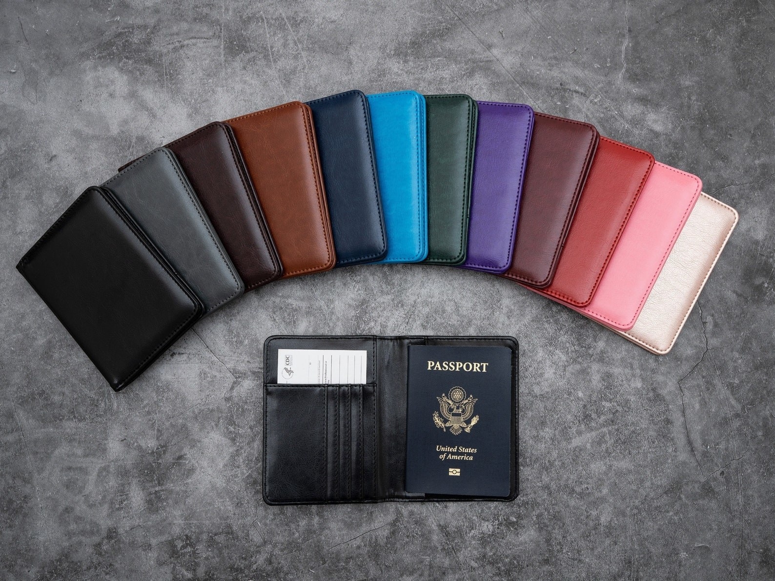 the leather holder, which has a slot for cards, a pocket for you vaccine card, and a holder for your passport