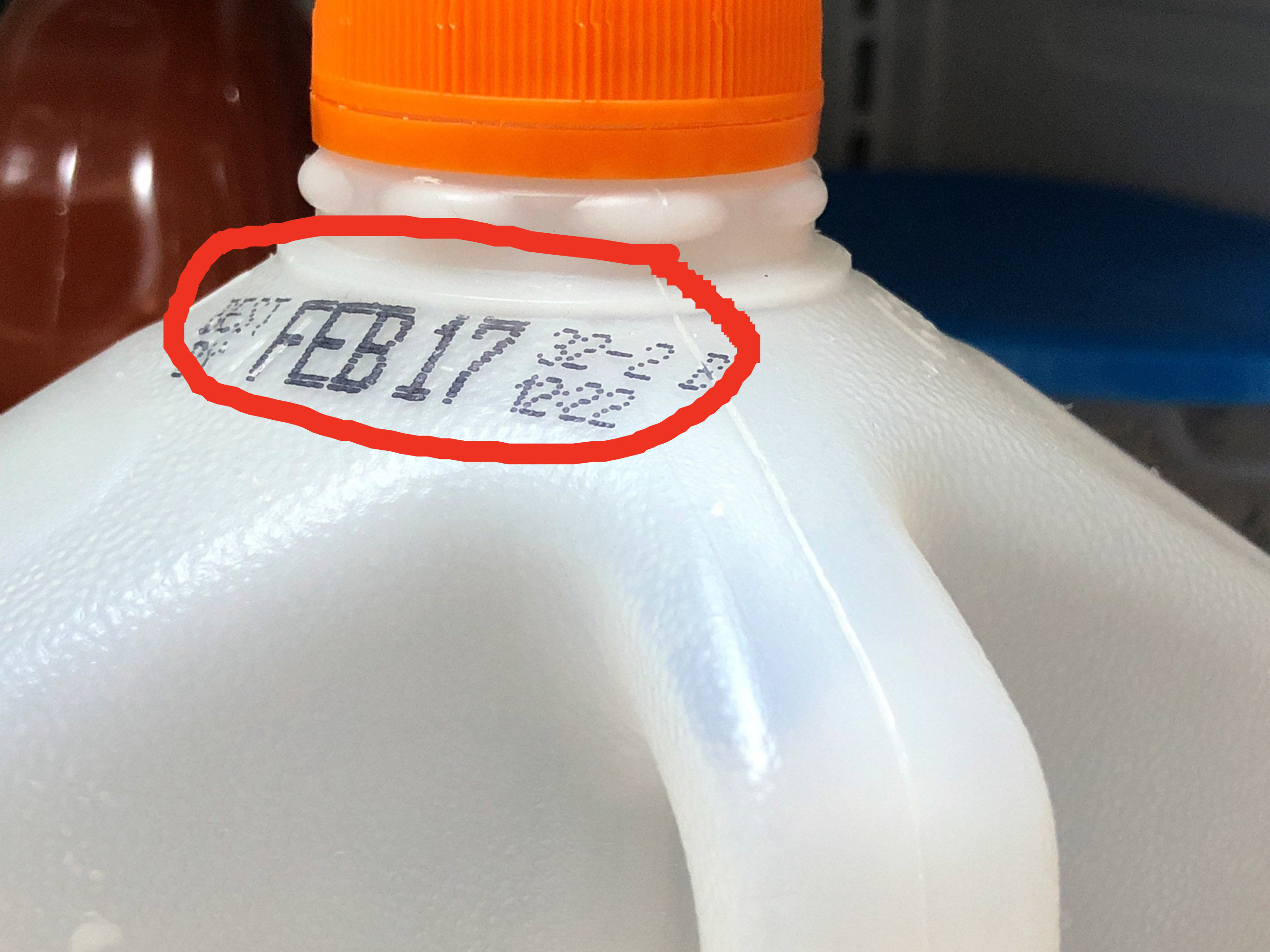 A gallon of milk with an expiration date.
